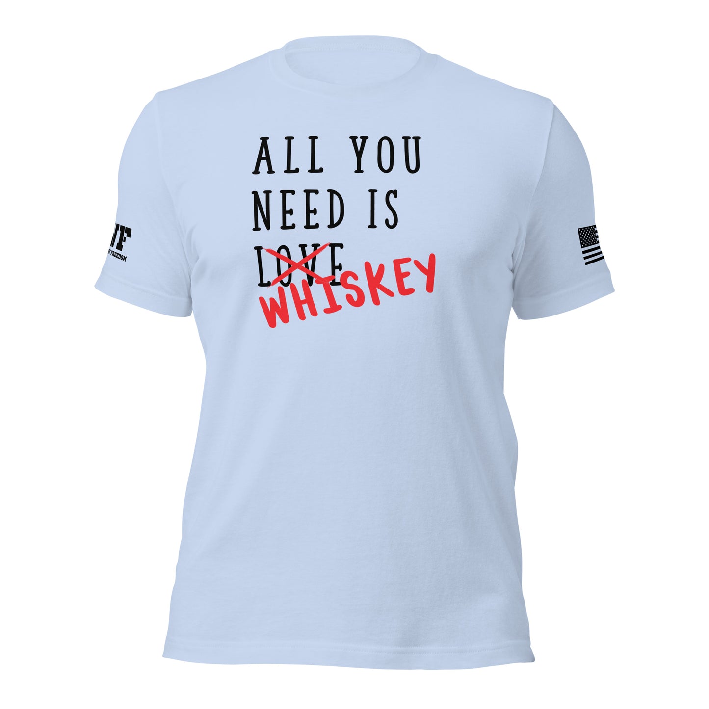 Rugged icey blue t-shirt featuring bold, distressed text that says "All You Need Is Love" — the word "Love" is crossed out with a rough red strike-through, and the word "whiskey" is scrawled over it in a bold, handwritten style. The design blends humor and grit with a rebellious, rugged vibe.
