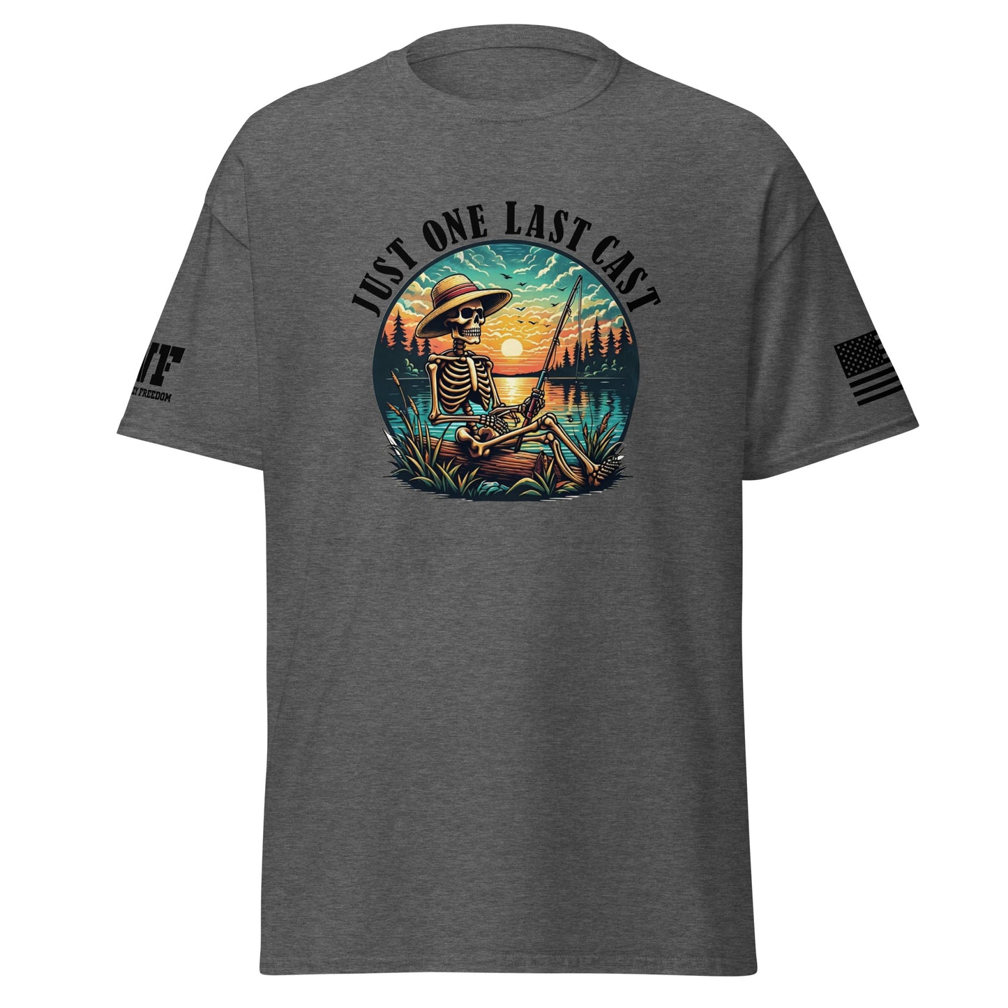 grey Shirt with a skeleton fisherman fishing on a lake. Says Just one last cast.