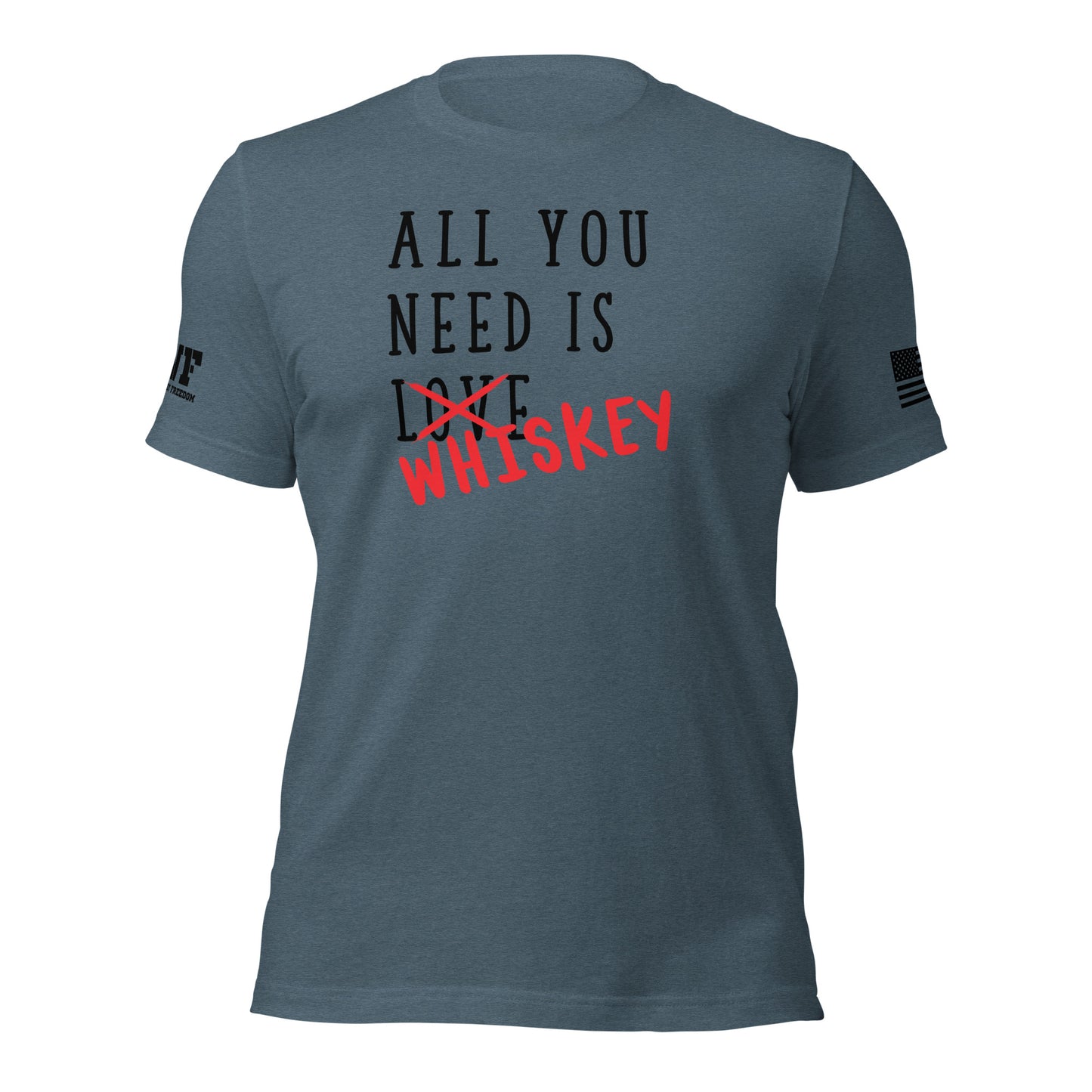Rugged blue t-shirt featuring bold, distressed text that says "All You Need Is Love" — the word "Love" is crossed out with a rough red strike-through, and the word "whiskey" is scrawled over it in a bold, handwritten style. The design blends humor and grit with a rebellious, rugged vibe.